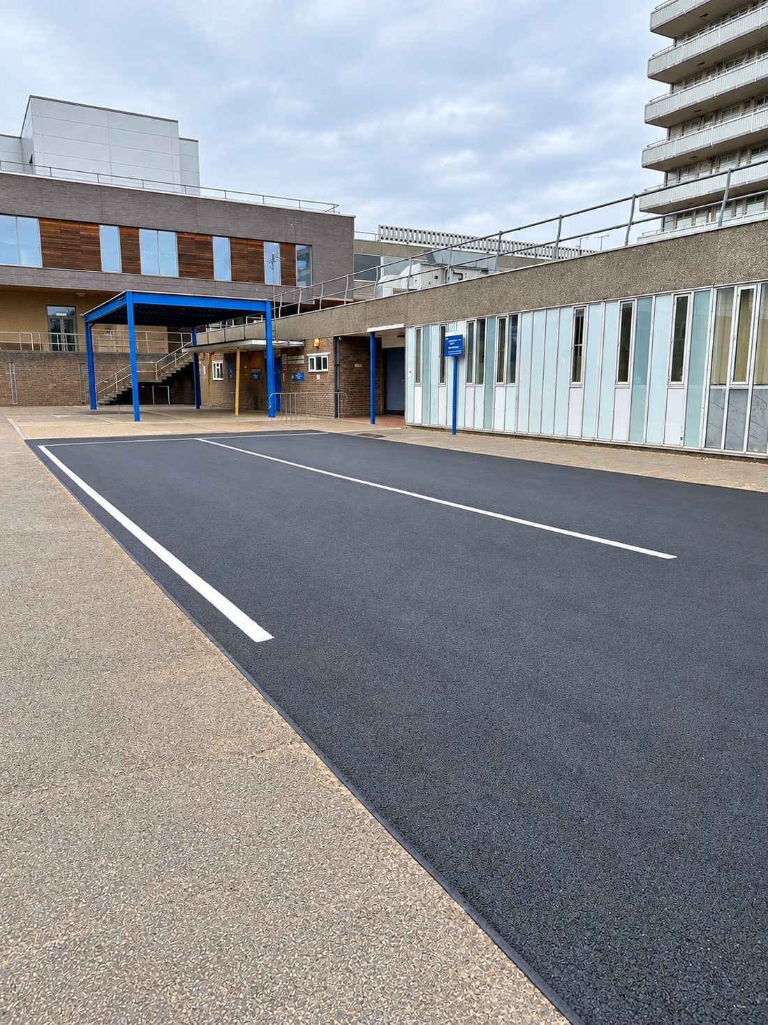 Newly resurfaced HGV parking area with fresh white line markings at Lister Hospital, Stevenage